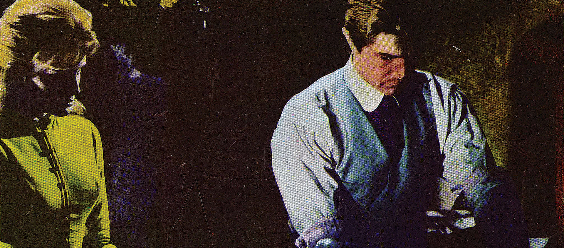 Kill, Baby...Kill film still with a man and women featured in saturated color