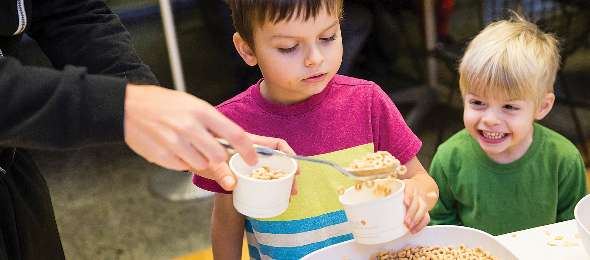 Child being served cereal