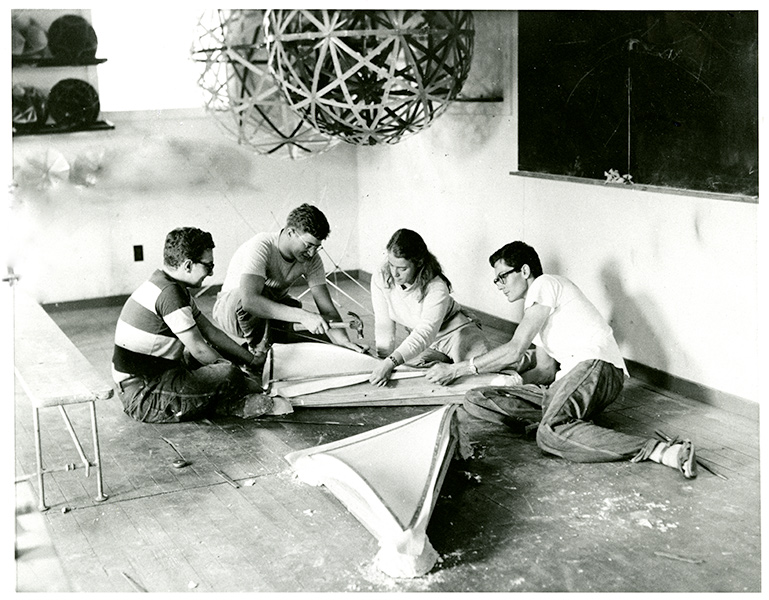 archival photo of students working underneath a geodesic dome