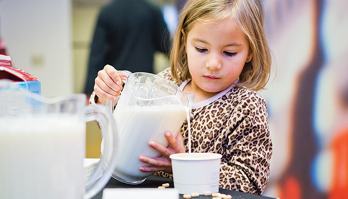 Child pouring milk