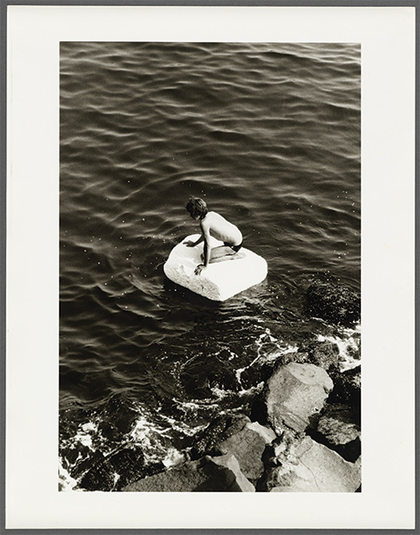 Boy on Raft, a 1978 gelatin silver print photograph by Peter Hujar