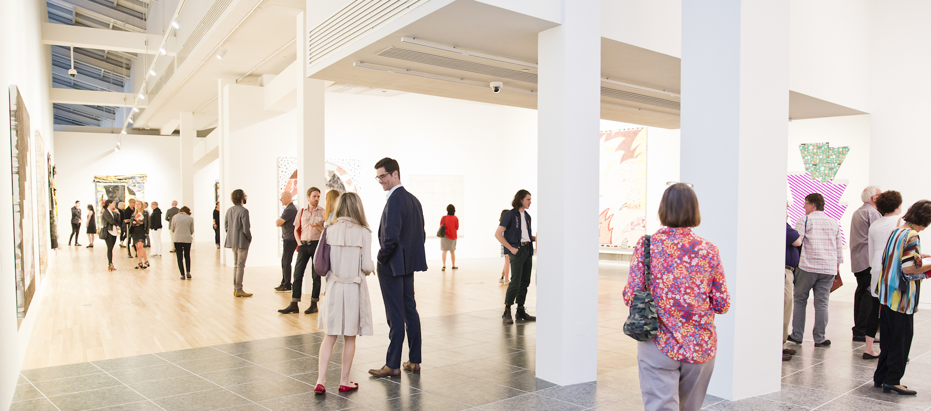 Image of gallery visitors during the May 18, 2018 preview reception for the Wexner Center for the Arts exhibition "Inherent Structure." Photo: Katie Spengler