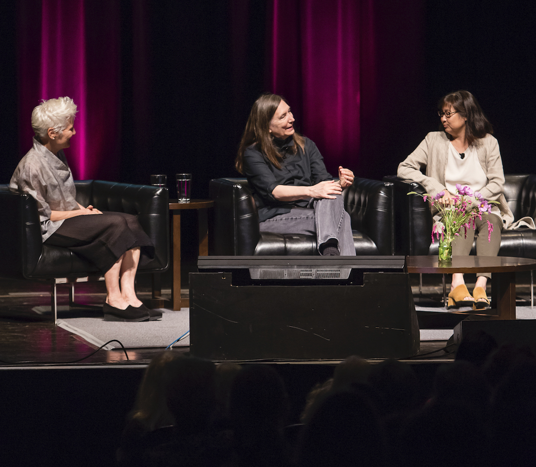 Artists Ann Hamilton, Jenny Holzer, and Maya Lin sitting on the stage of Mershon Auditorium, discussing their work as part of opening events for the fall 2019 exhibition HERE at the Wexner Center for the Arts. Photo by Katie Gentry