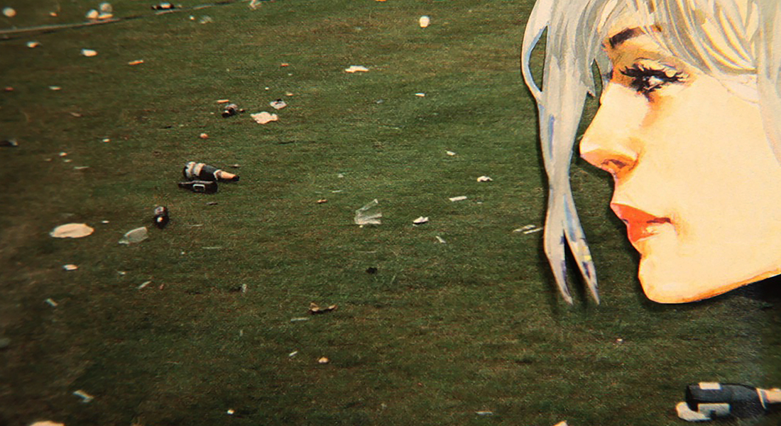 In this color collage, a still from the film, a paper cut out of a face looks out on a green field that's covered in trash.