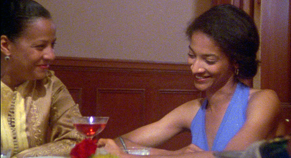 two women sharing a table are having an enjoyable conversation.